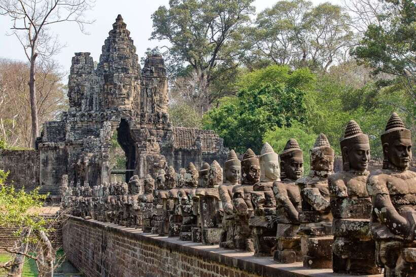 Siem Reap: Angkor Wat Sunrise Bike Tour & Jungle Breakfast - Bayon and the Terrace of the Elephants: where the city seems to watch you